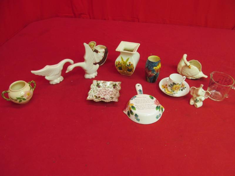 lot 53 image: Variety of figurines, tea set, measuring cup, vases