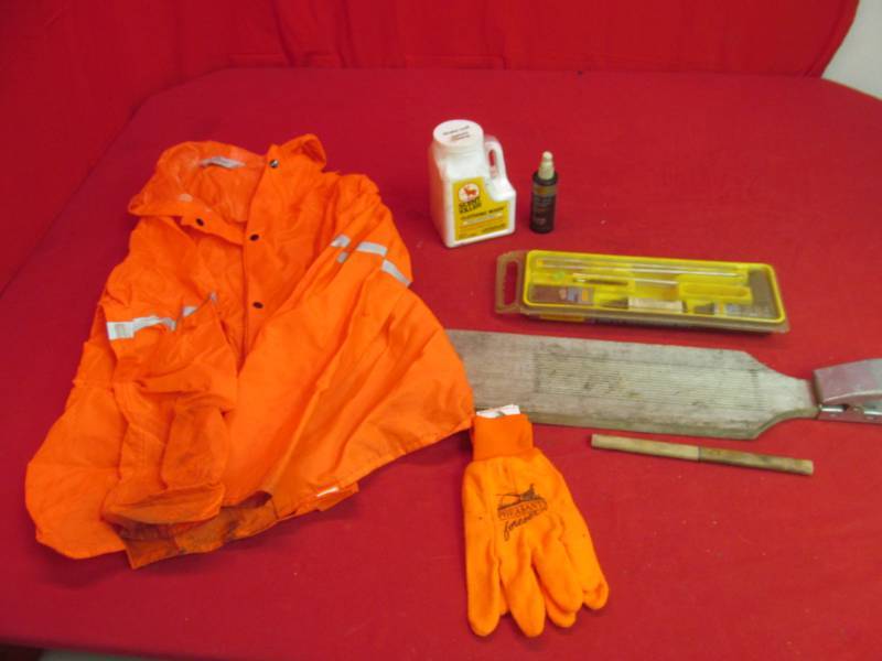 lot 147 image: Fish cutting board, hunting gloves, gun cleaning kit, scent killer, coat