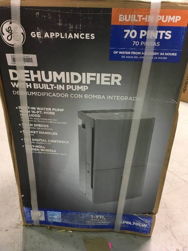 lot 28 image: GE Dehumidifier with Built-in Pump not used