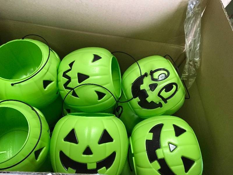 lot 107 image: Case of 24 green pumpkin candy pails not used
