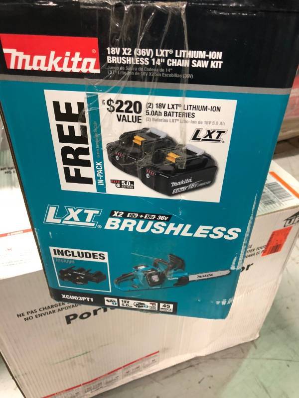 lot 133 image: Makita 14 in. 18-Volt X2 (36-Volt) LXT Lithium-Ion Brushless Cordless Chain Saw Kit with (4) Batteries 5.0Ah and Charger not used