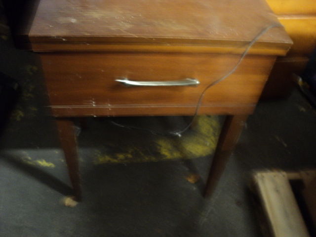 empty sewing machine cabinet...