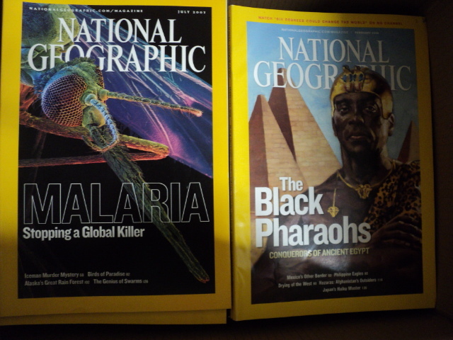 2 boxes of hard cover books and Nat...