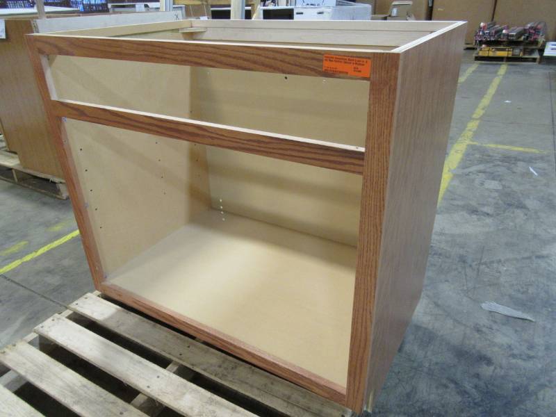 lot 109 image: Hampton Bay 36x34.5 x24 in. Sink Base Kitchen Cabinet in Medium Oak