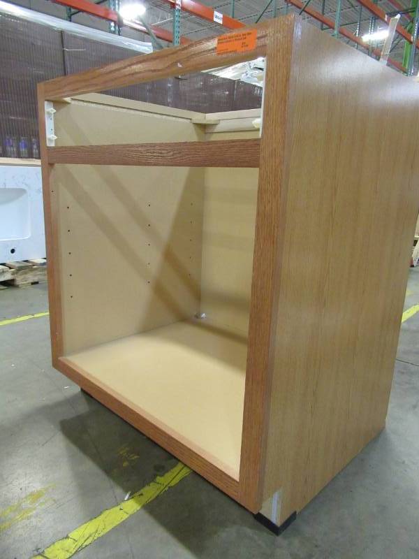 lot 110 image: Hampton Bay 30x34.5x24 in. Sink Base Kitchen Cabinet in Medium Oak