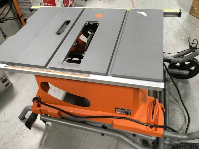 lot 10 image: Ridgid R4513 15 Amp 10 in. Heavy-Duty Portable Table Saw with Stand