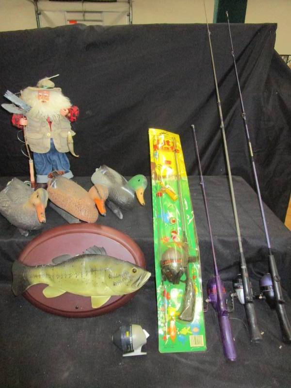 lot 26 image: Remington Decoys Fishing Santa, talking and singing fish,and various fishing poles