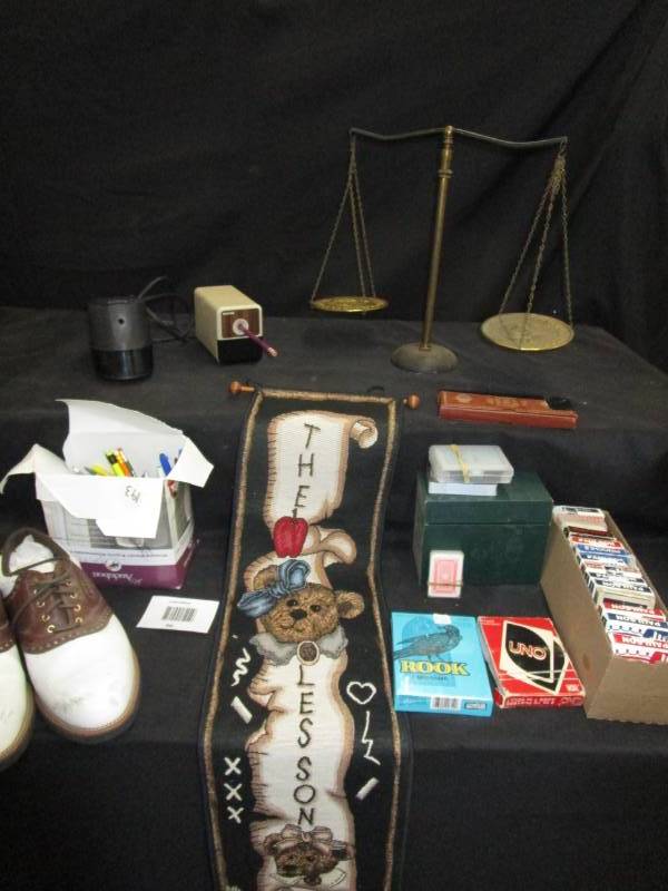 lot 36 image: Brass scale, Dunlop golf shoes sz 9 12, pencil sharpeners, pens, cards and various games