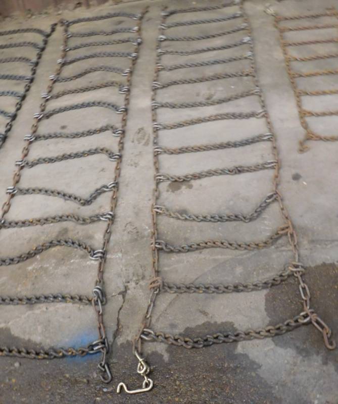 lot 20 image: Set of New Tire Chains - 106 x 21 (w)