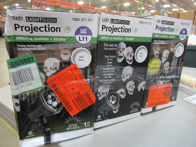 lot 55 image: Three LED Projector Chasing Skull Strobe Spotlight - New in Box