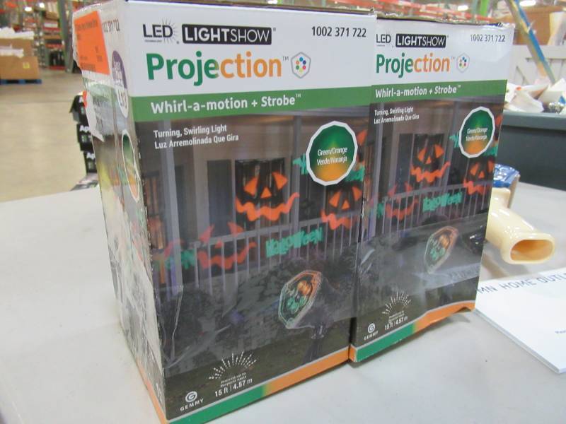 lot 57 image: Two LED Chasing Happy Halloween Strobe Spotlight - New in Box.