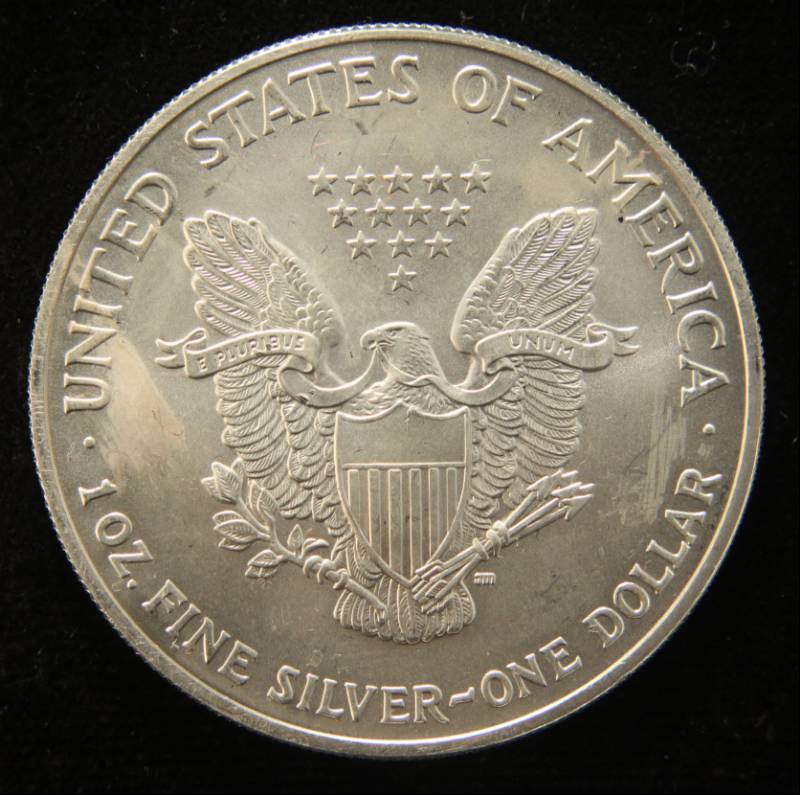lot 44 image: 2004 AMERICAN SILVER EAGLE 1 TROY OZ. .999 FINE SILVER DOLLAR