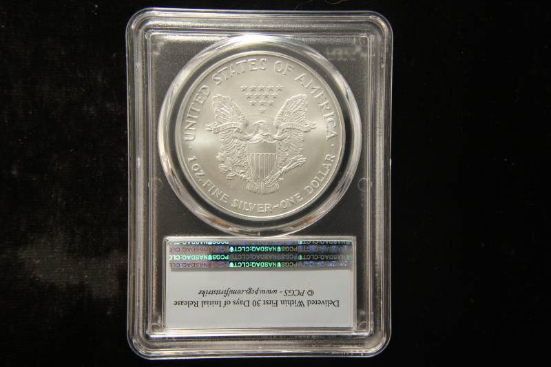 lot 61 image: 2003 AMERICAN SILVER EAGLE 1 TROY OZ. .999 FINE SILVER MS69 PCGS FIRST STRIKE