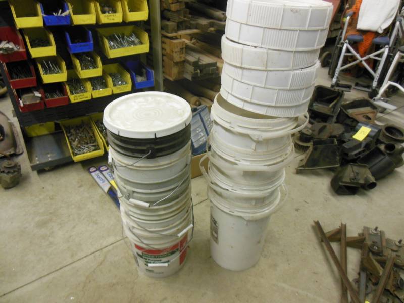 Ten 5 gallon pails with some covers...
