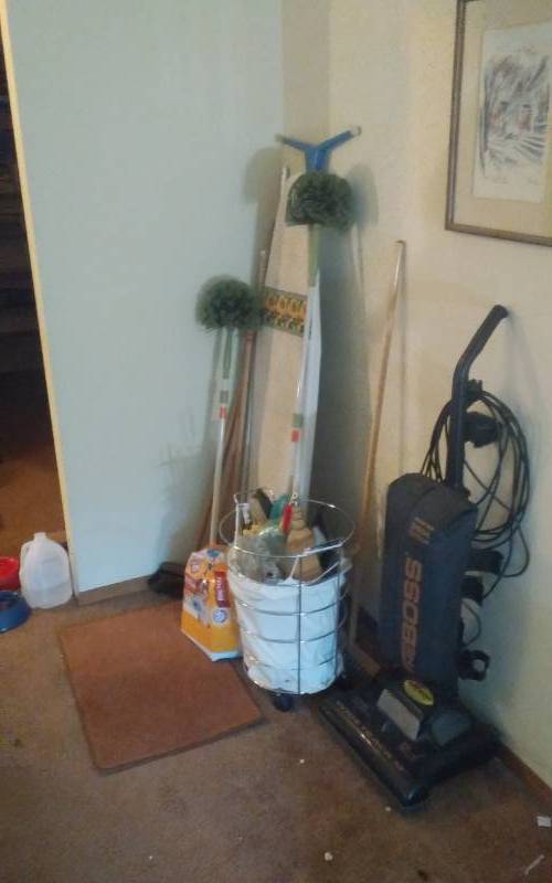 lot 41 image: Eureka Boss Vacuum, Brooms, Hamper, Iron Board, Misc.
