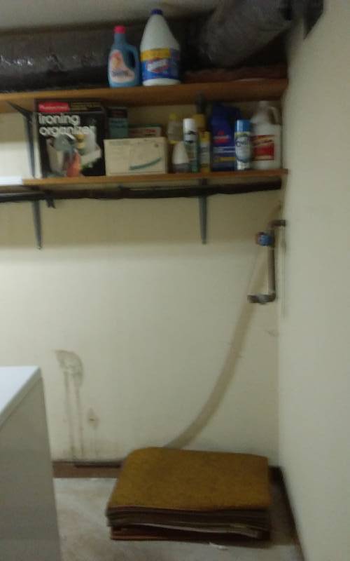 lot 83 image: Cleaning Supplies, Iron, Organizer, Stack Of Rugs