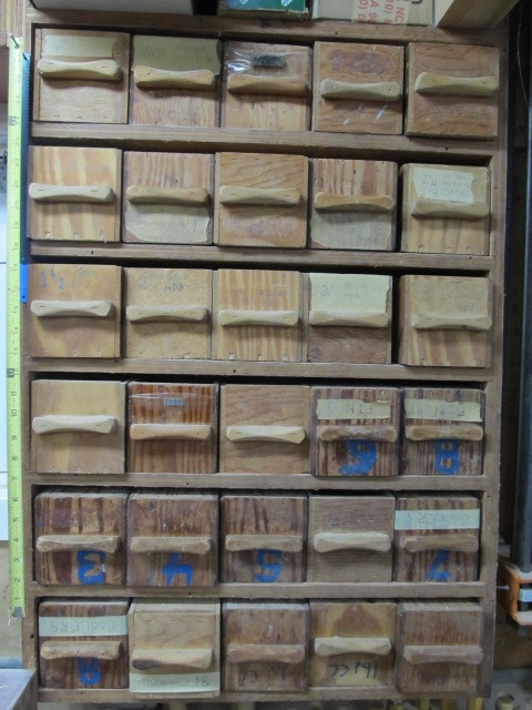 lot 134 image: Lot of 30 Vintage Wooden HardwareParts Drawers wContents