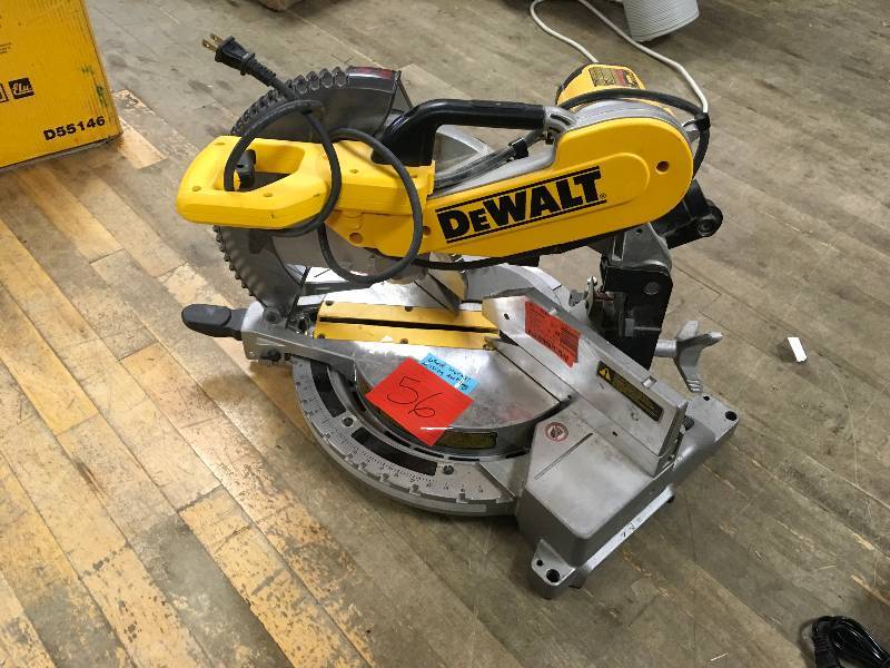 lot 56 image: DEWALT DW716 12 in. Double-Bevel Compound Miter Saw  USED WORKS MISSING DUST BAG in working conditions