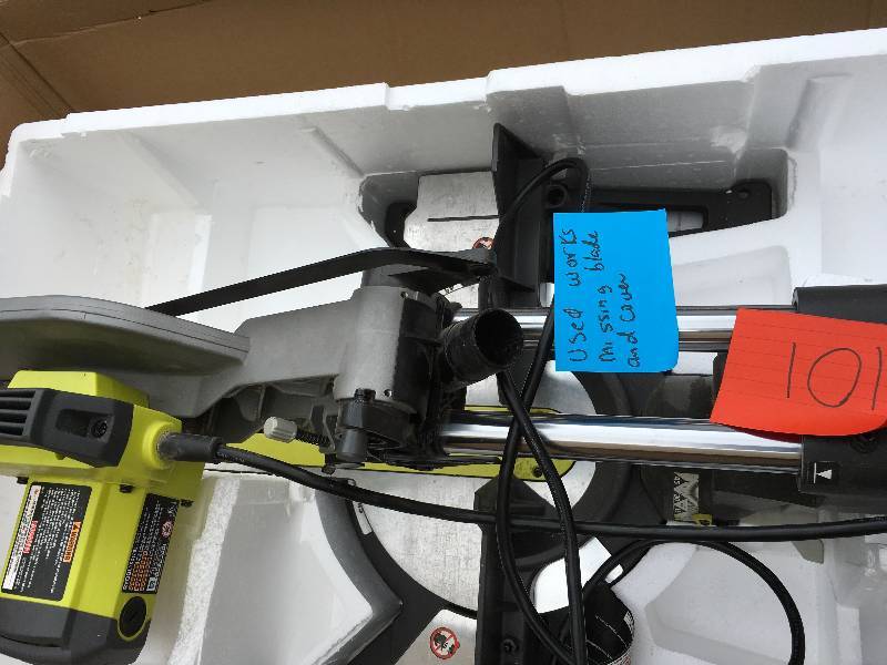 lot 101 image: RYOBI TSS120L 12-IN. SLIDING COMPOUND MITER SAW USED WORKS MISSING BLADE AND COVER