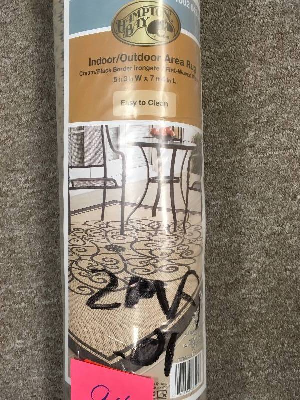 lot 94 image: Hampton Bay Border Iron Gate CreamBlack 5 ft. x 7 ft. IndoorOutdoor Area Rug not used