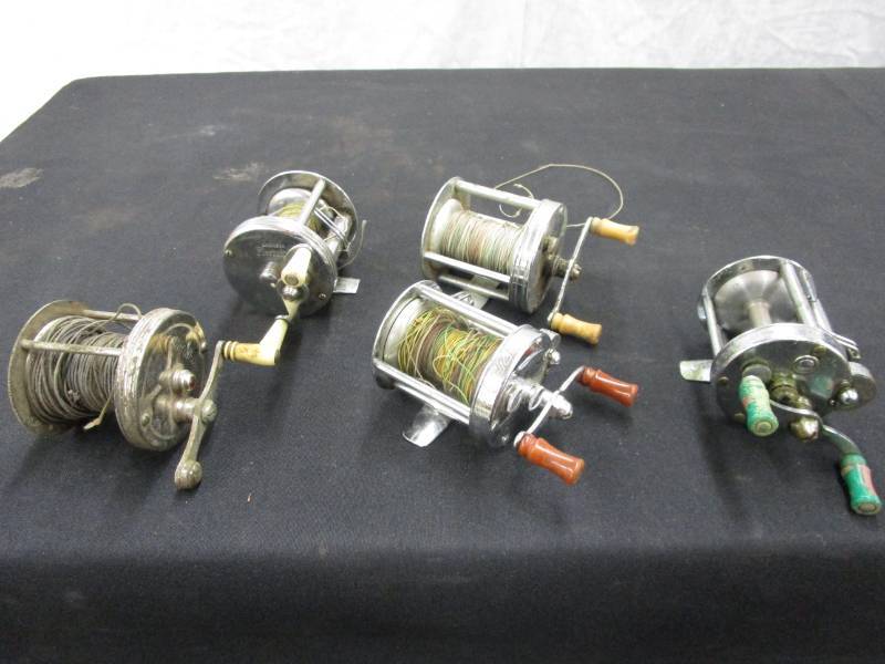 lot 48 image: Thee Pflueger , 1 Defiance, and 1 Bronson fishing Reels