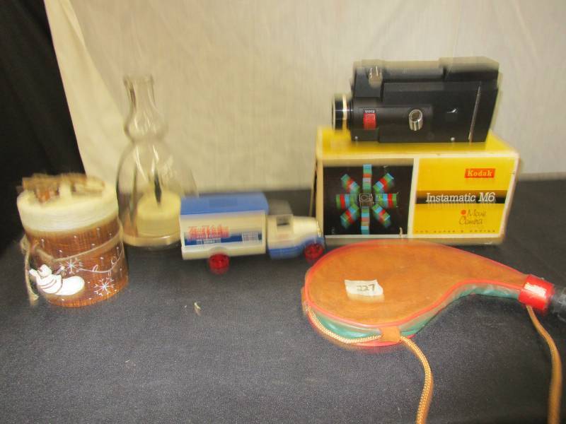 lot 52 image: Wine bag, Kodak Camera, Candle, Trur Value Truck Bank and Wedding Music