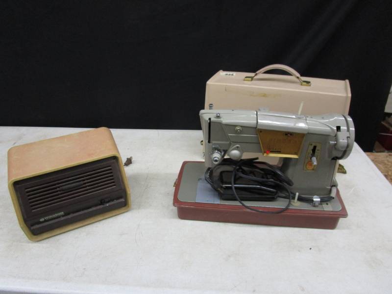 lot 85 image: Singer Sewing machine in case and Air Treatment devise