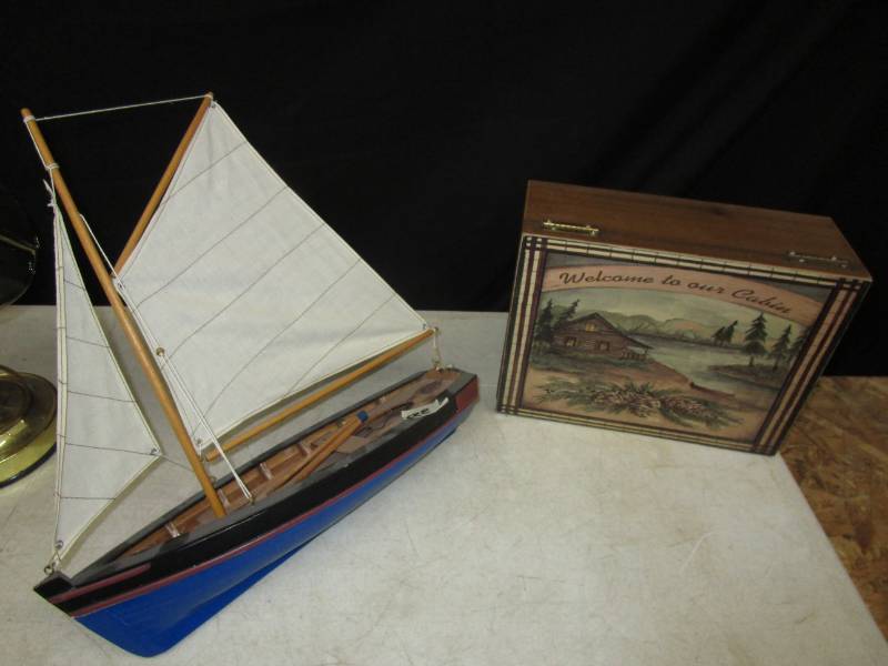 lot 89 image: Sail Boat and cute wooden box says welcome to our cabin