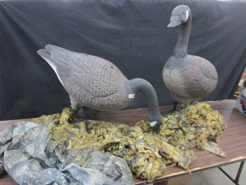 lot 95 image: 2 Large Standing Goose Decoys, Camoflauge Cover, and Other Camoflauge