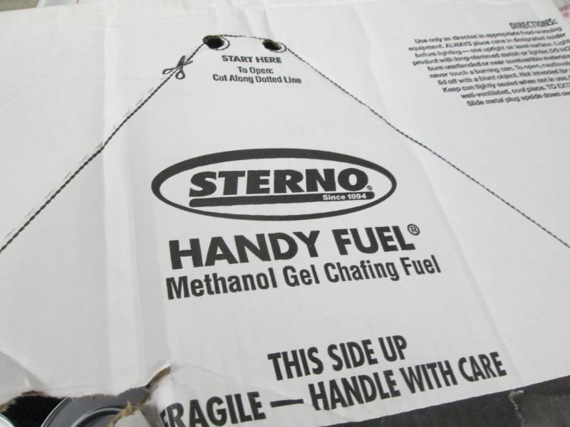 lot 245 image: Damaged Case of Sterno Cans...