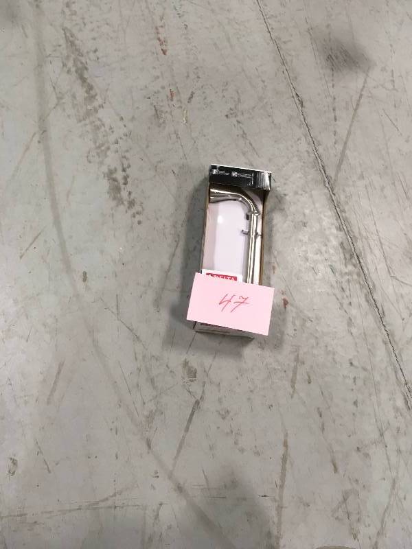 lot 47 image: DELTA Addison Pivoting Toilet Paper Holder in Brilliance Stainless not used