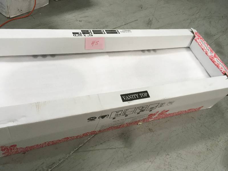 lot 48 image: ANSY VANITY TOP CULTURED MARBLE 61 IN X 22 IN D not used