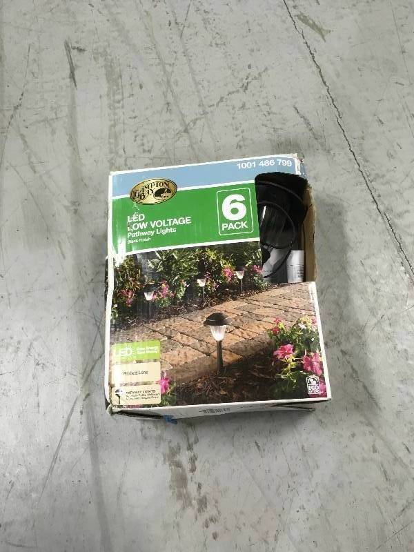 lot 62 image: 6 Pack Hampton Bay LED Low Voltage Pathway Lights Black Finish (1001 486 799) not used