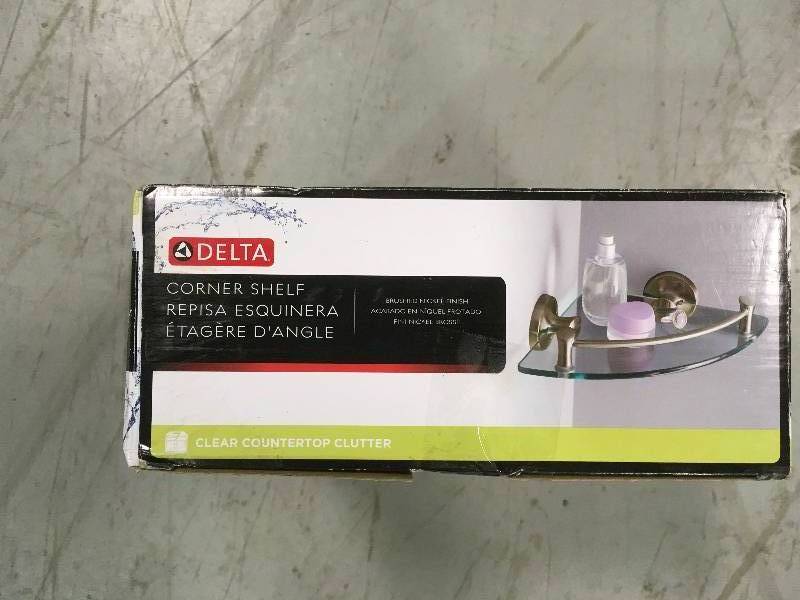 lot 68 image: DELTA 8 in. W Glass Corner Shelf in Brushed Nickel not used
