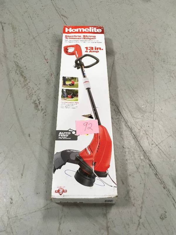 lot 92 image: Homelite UT41112B 13 in. 4 Amp Straight Electric String Trimmer used in working conditions