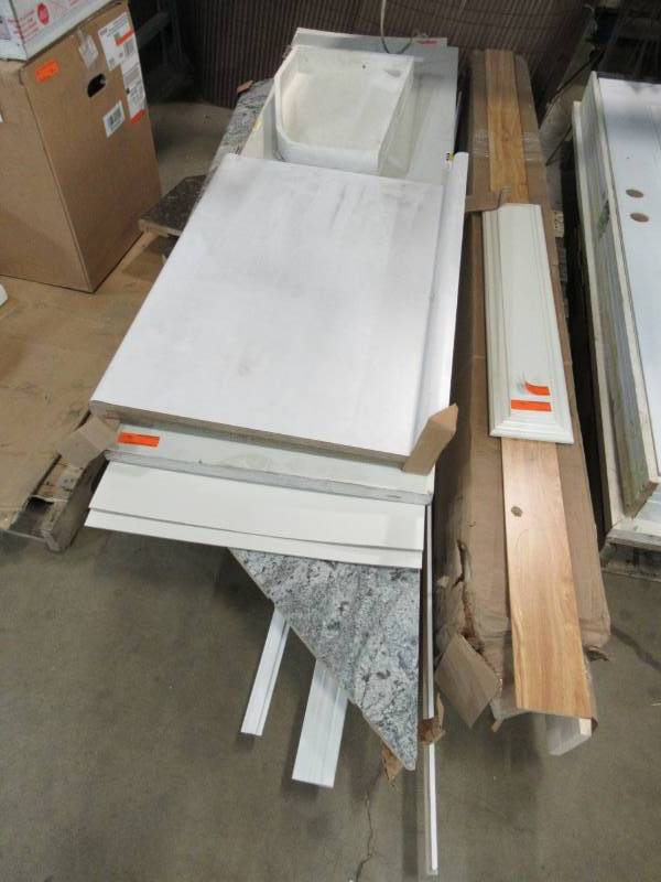 lot 101 image: Pallet of Damaged Counter Tops, Door, Laminate Sheeting, Molding and More.