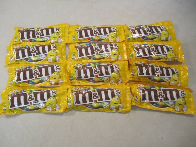 lot 105 image: 12 Bags of Peanut M&Ms Best by Jun...