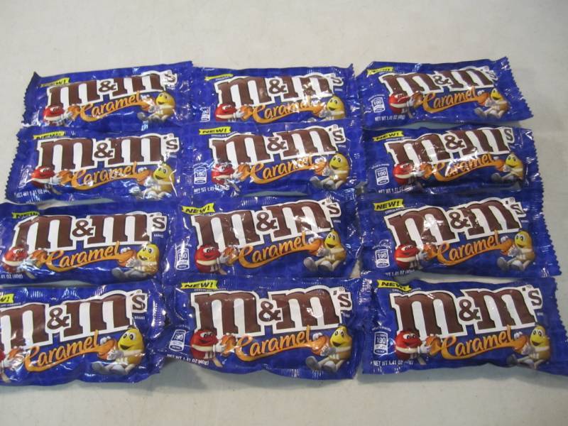 lot 106 image: 12 Bags of Caramel M&Ms Best by Ma...