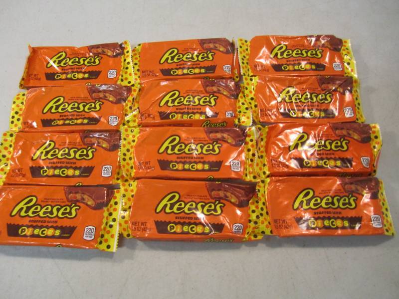 lot 107 image: 12 Reeses Pieces Peanut Butter Cups...