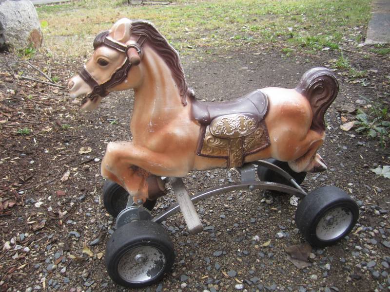 lot 127 image: Vintage Bounce Horse on Wheels  RED...