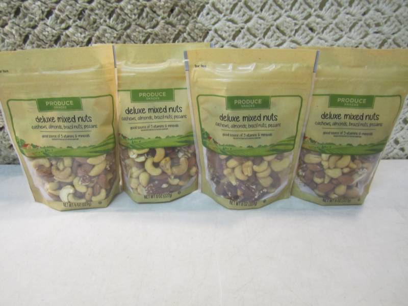 lot 204 image: 4 Bags of Deluxe Mixed Nuts Best by...