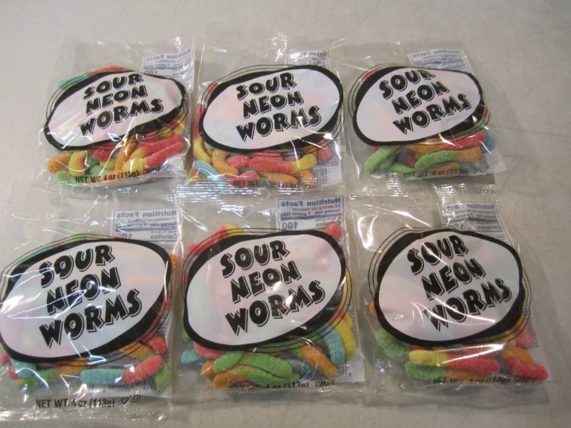 lot 211 image: 6 Bags of Sour Neon Worms Best by F...