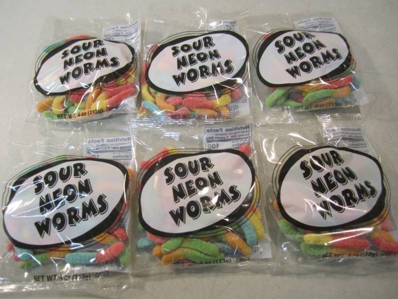 lot 212 image: 6 Bags of Sour Neon Worms Best by F...