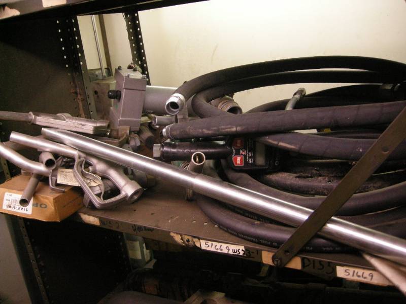 lot 400 image: Shelf of Fuel Pumps, Hose, Nozzles
