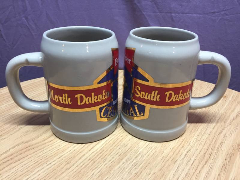 lot 47 image: 2 Budweiser ND & SD Centennial Mugs