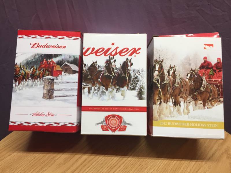 lot 32 image: 2010, 2011 and 2012 Budweiser Holiday Steins