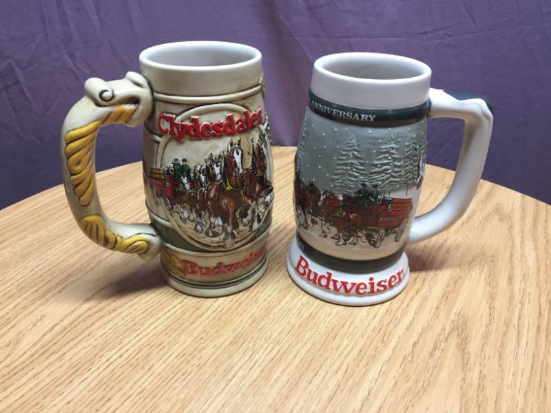 lot 53 image: 1982 & 1983 Budweiser Holiday Steins