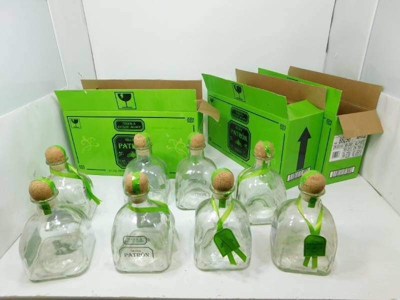 lot 7 image: Eight Silver Patron Tequila Bottles