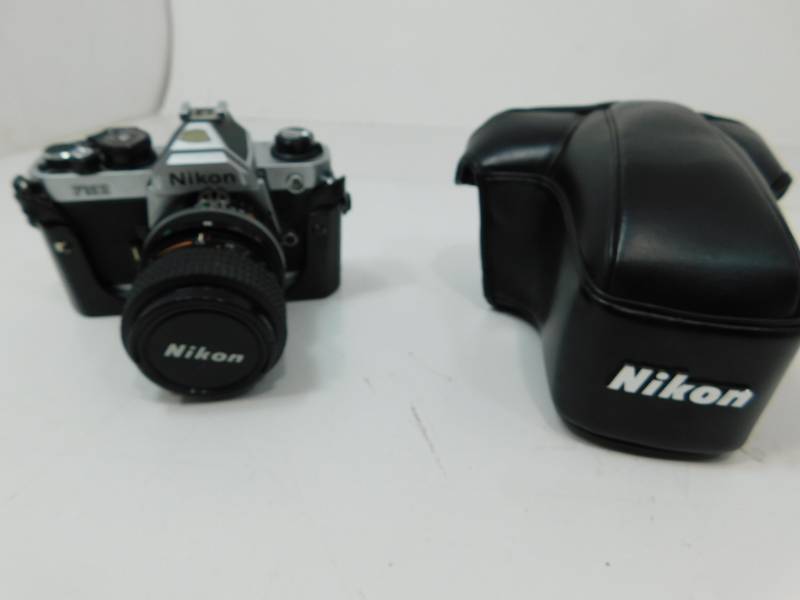 lot 19 image: Nikon FM2 35 mm SLR Film Camera  (In Carrying Case)