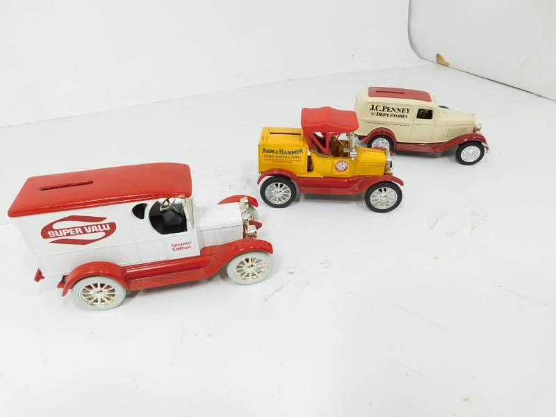 lot 35 image: Three  Metal Replica Car Banks